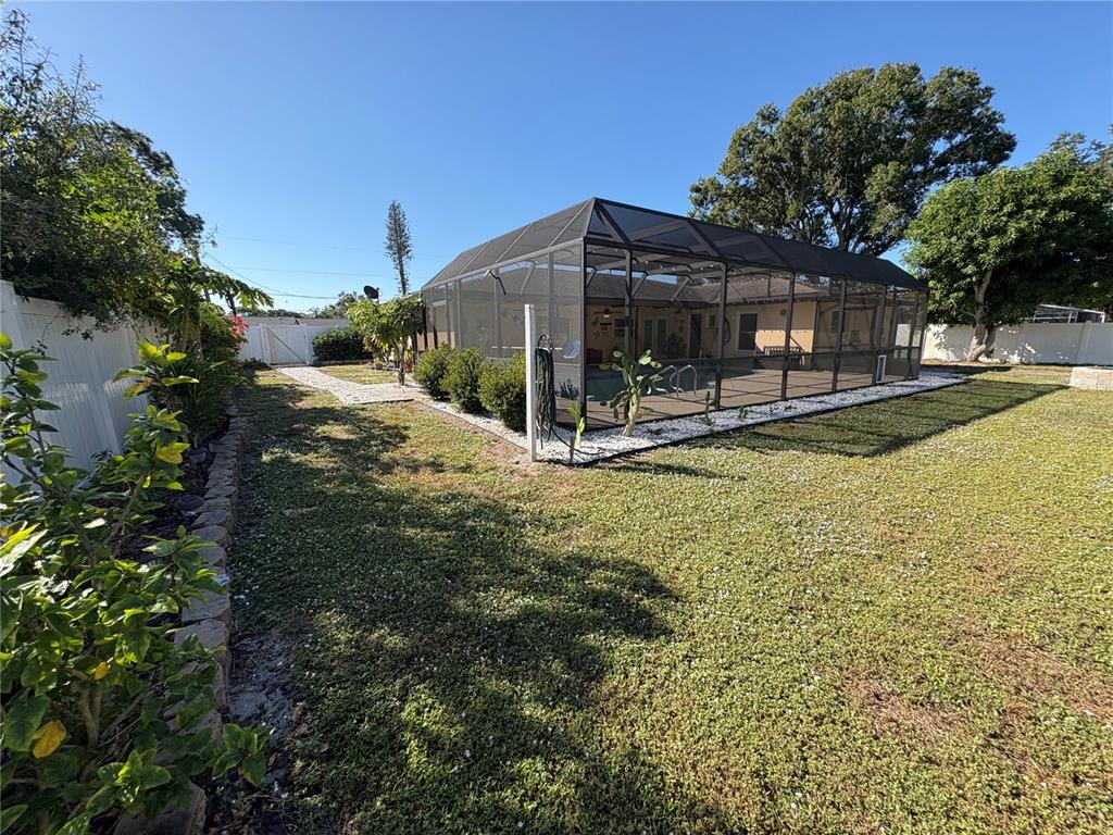 1117 Angela Maria Road Sarasota, FL 34243 - Photo 46 of 52 a view of a house with swimming pool and sitting area