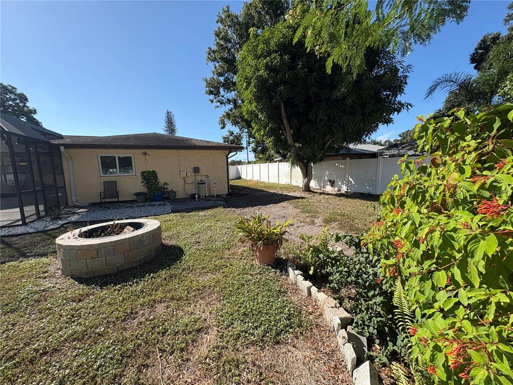 1117 Angela Maria Road Sarasota, FL 34243 - Photo 49 of 52 a front view of a house with a yard