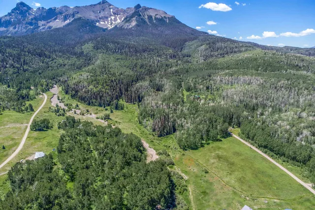 a view of a town with mountains in the background