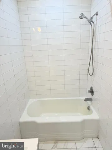 a bathroom with a bath tub