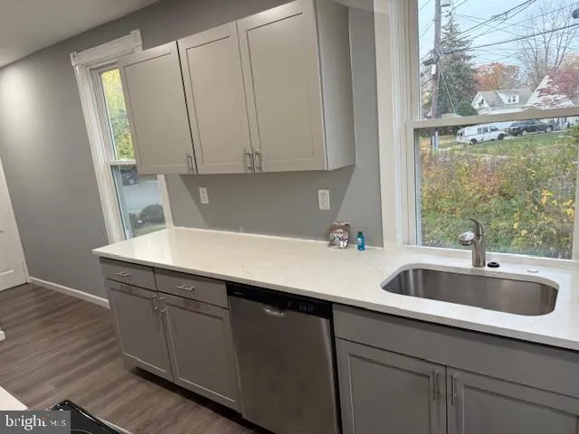 a kitchen with a sink and cabinets
