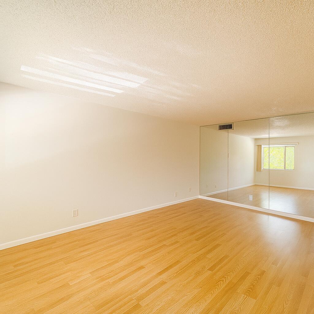 3000 Springdale Boulevard, Unit V303 Palm Springs, FL 33461 - Photo 11 of 22 a view of an empty room and window