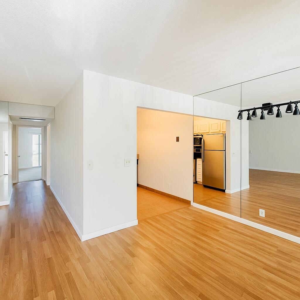 3000 Springdale Boulevard, Unit V303 Palm Springs, FL 33461 - Photo 12 of 22 a view of a hallway with wooden floor