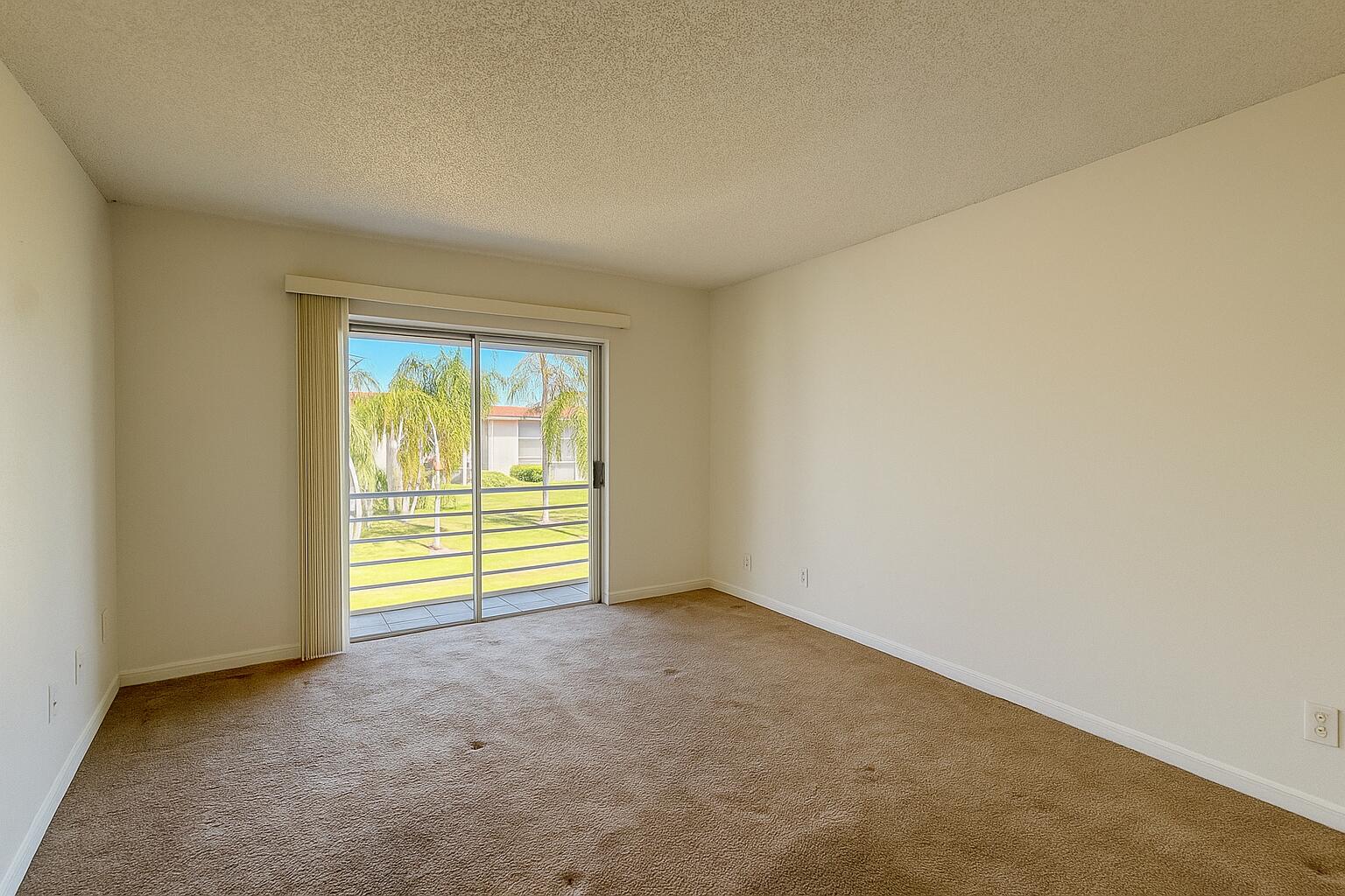 3000 Springdale Boulevard, Unit V303 Palm Springs, FL 33461 - Photo 15 of 22 an empty room with a window
