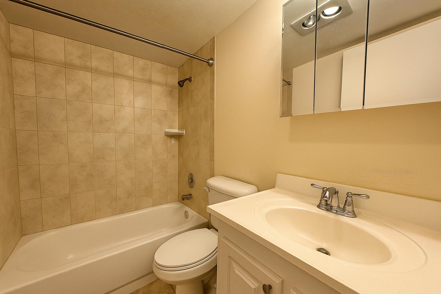 3000 Springdale Boulevard, Unit V303 Palm Springs, FL 33461 - Photo 17 of 22 a bathroom with a sink toilet and shower