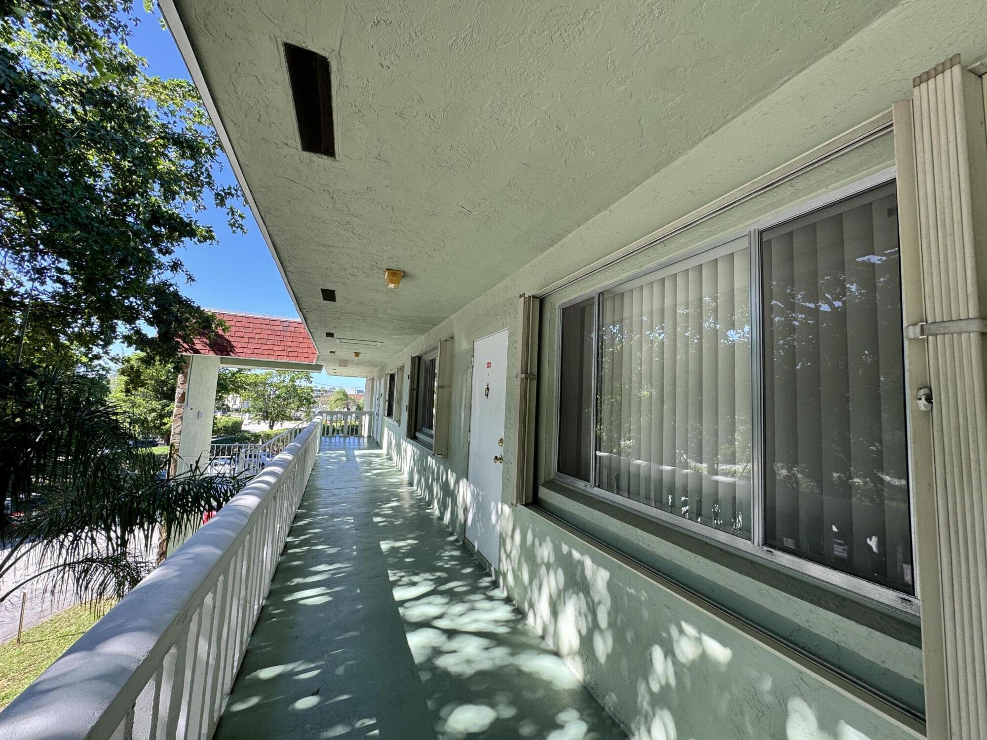 3000 Springdale Boulevard, Unit V303 Palm Springs, FL 33461 - Photo 2 of 22 a view of a balcony