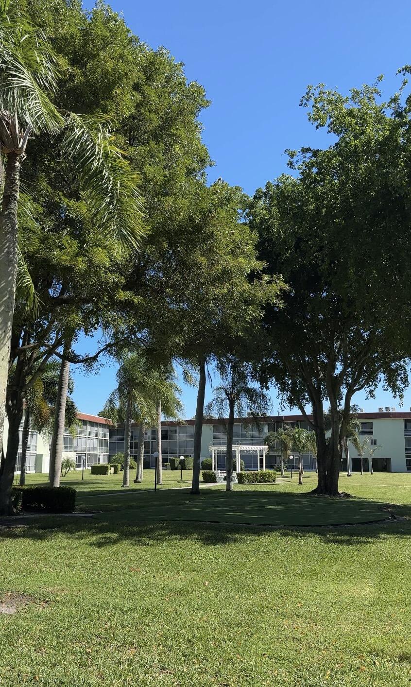 3000 Springdale Boulevard, Unit V303 Palm Springs, FL 33461 - Photo 22 of 22 a view of a park with large trees