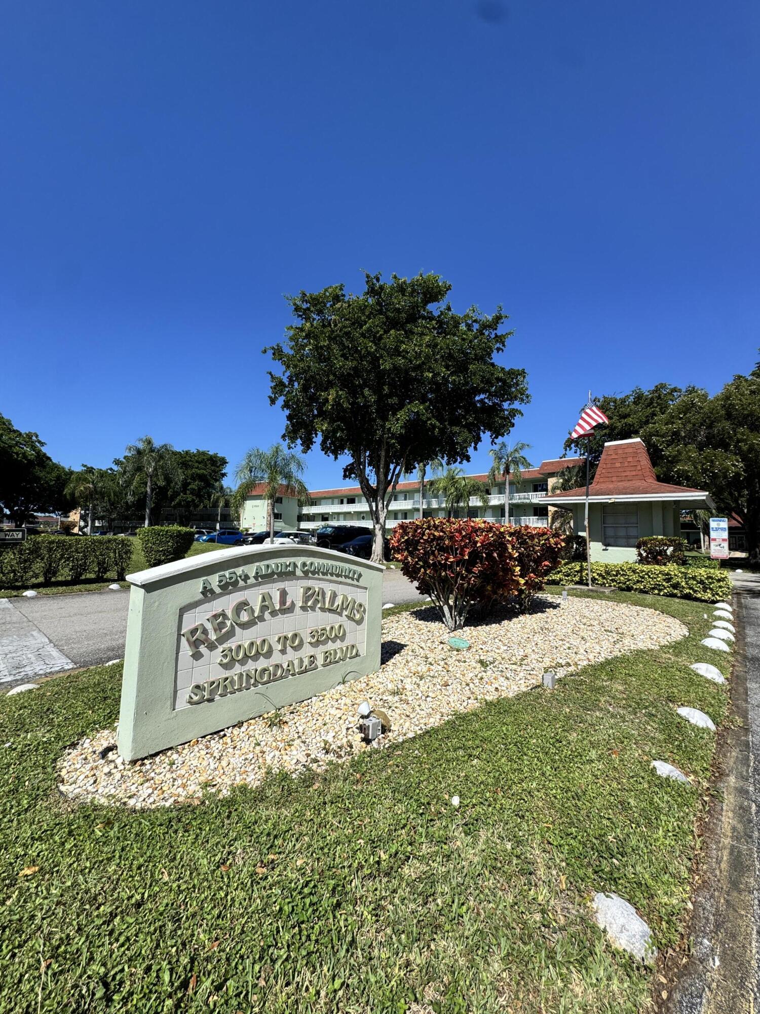 3000 Springdale Boulevard, Unit V303 Palm Springs, FL 33461 - Photo 4 of 22 a view of a street with a house in the background