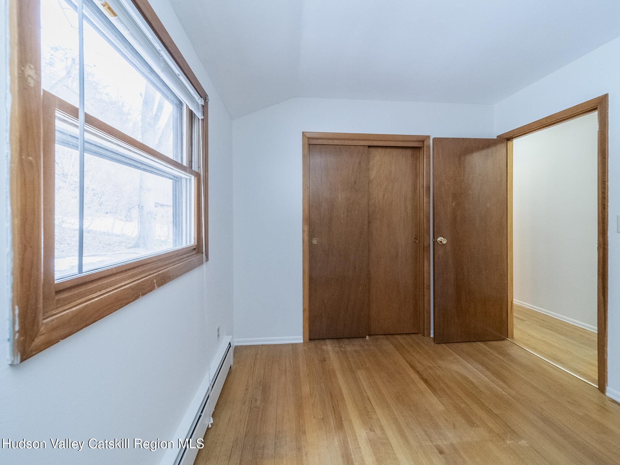30 Redwood Road Saugerties, NY 12477 - Photo 17 of 31 a view of an empty room with wooden floor and a window