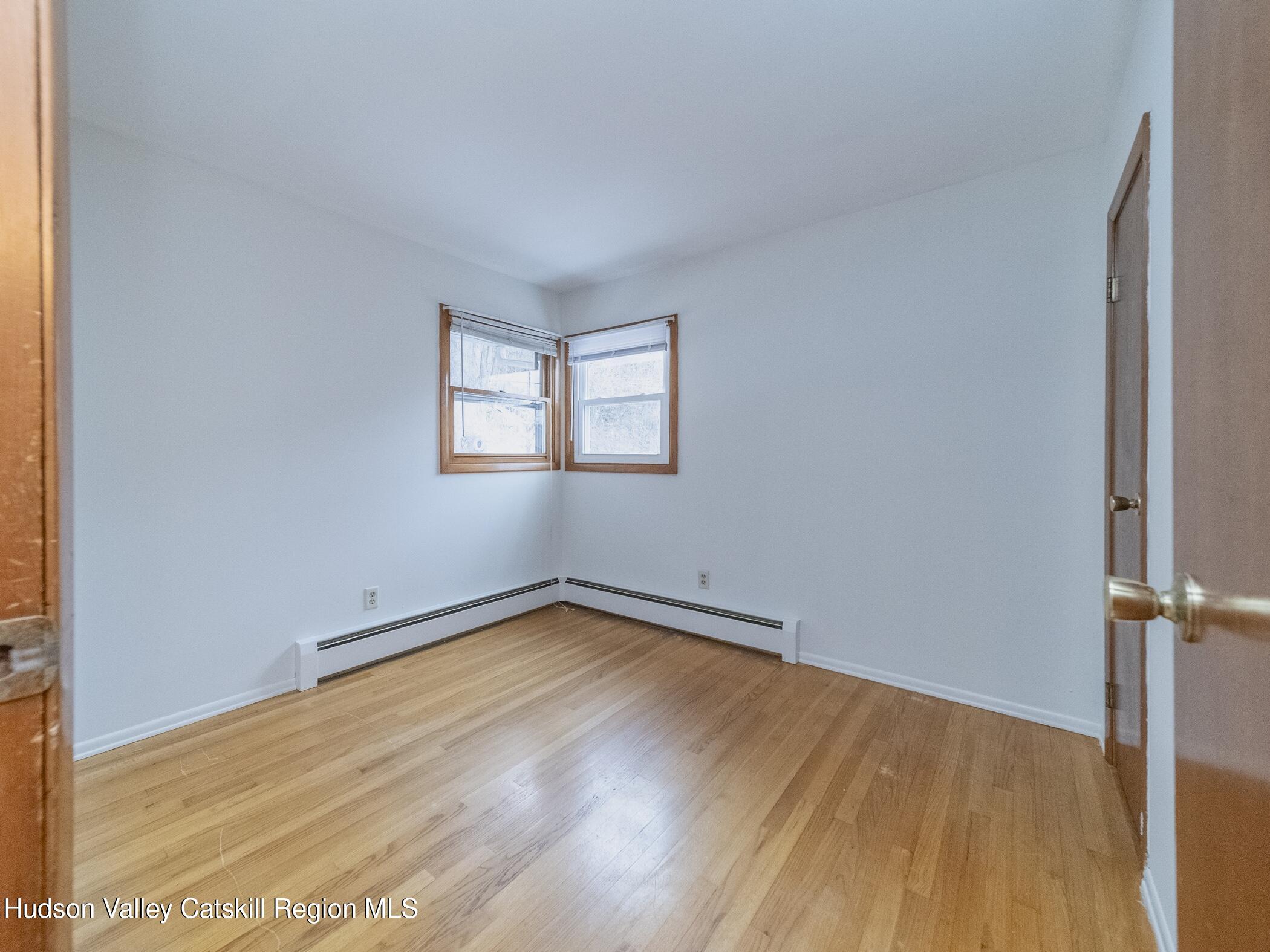 30 Redwood Road Saugerties, NY 12477 - Photo 20 of 31 an empty room with wooden floor and windows