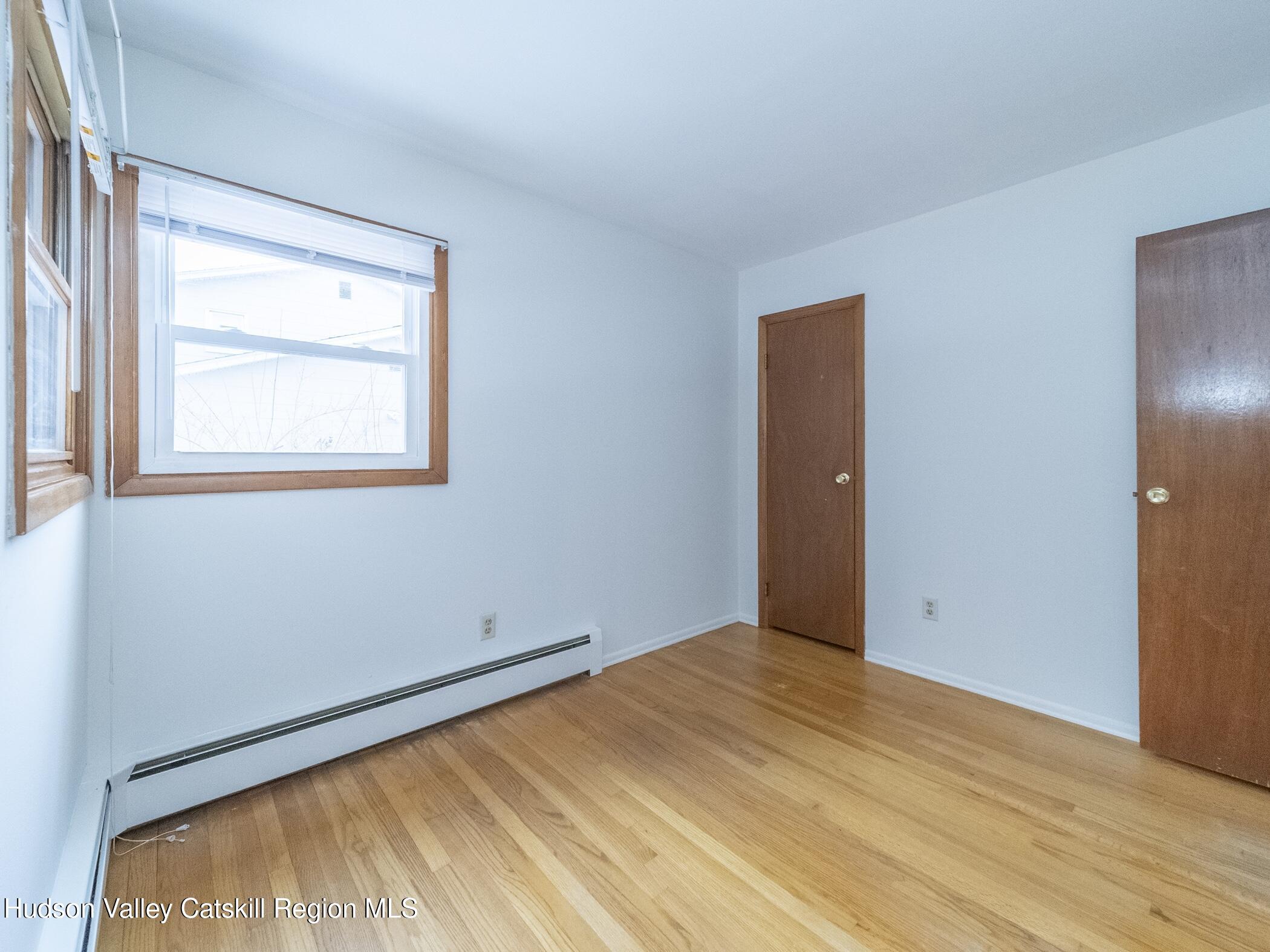 30 Redwood Road Saugerties, NY 12477 - Photo 21 of 31 a view of an empty room with wooden floor and a window