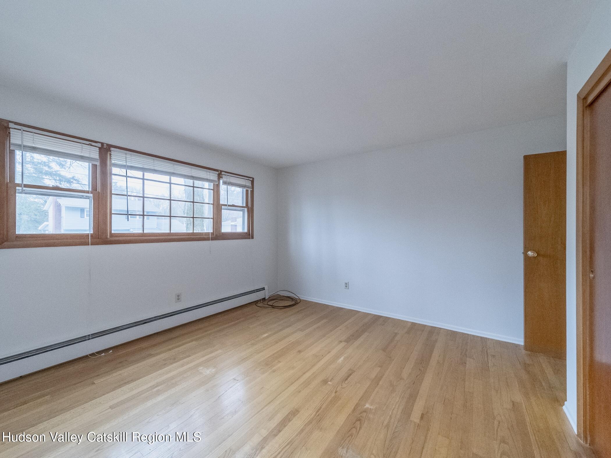 30 Redwood Road Saugerties, NY 12477 - Photo 24 of 31 a view of an empty room with wooden floor and a window