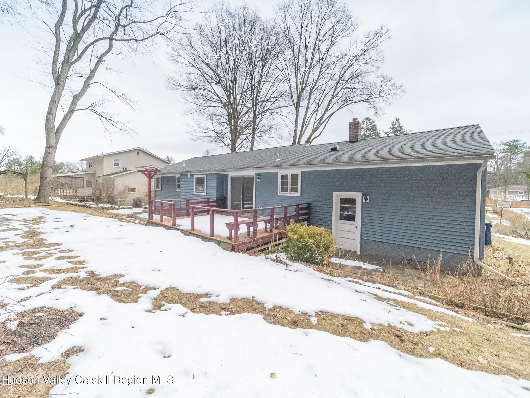 30 Redwood Road Saugerties, NY 12477 - Photo 29 of 31 a front view of a house with a yard covered in snow