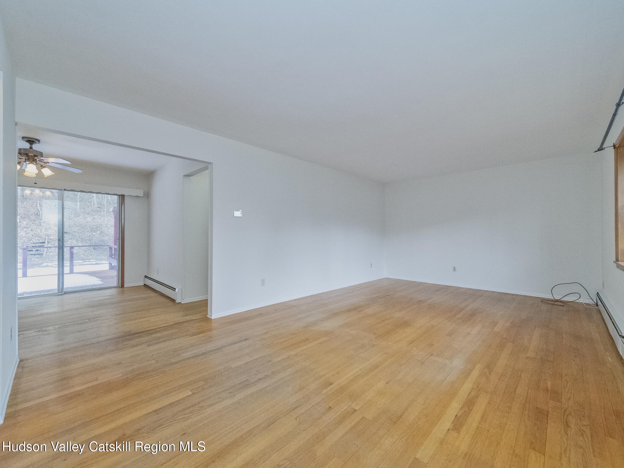 30 Redwood Road Saugerties, NY 12477 - Photo 4 of 31 a view of an empty room with wooden floor and windows
