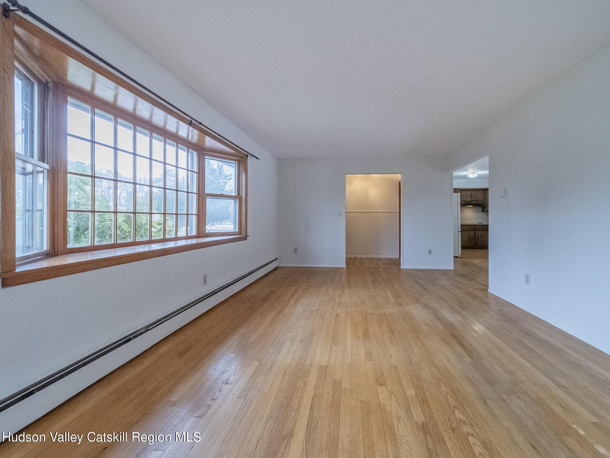 30 Redwood Road Saugerties, NY 12477 - Photo 6 of 31 a view of empty room with wooden floor and fan