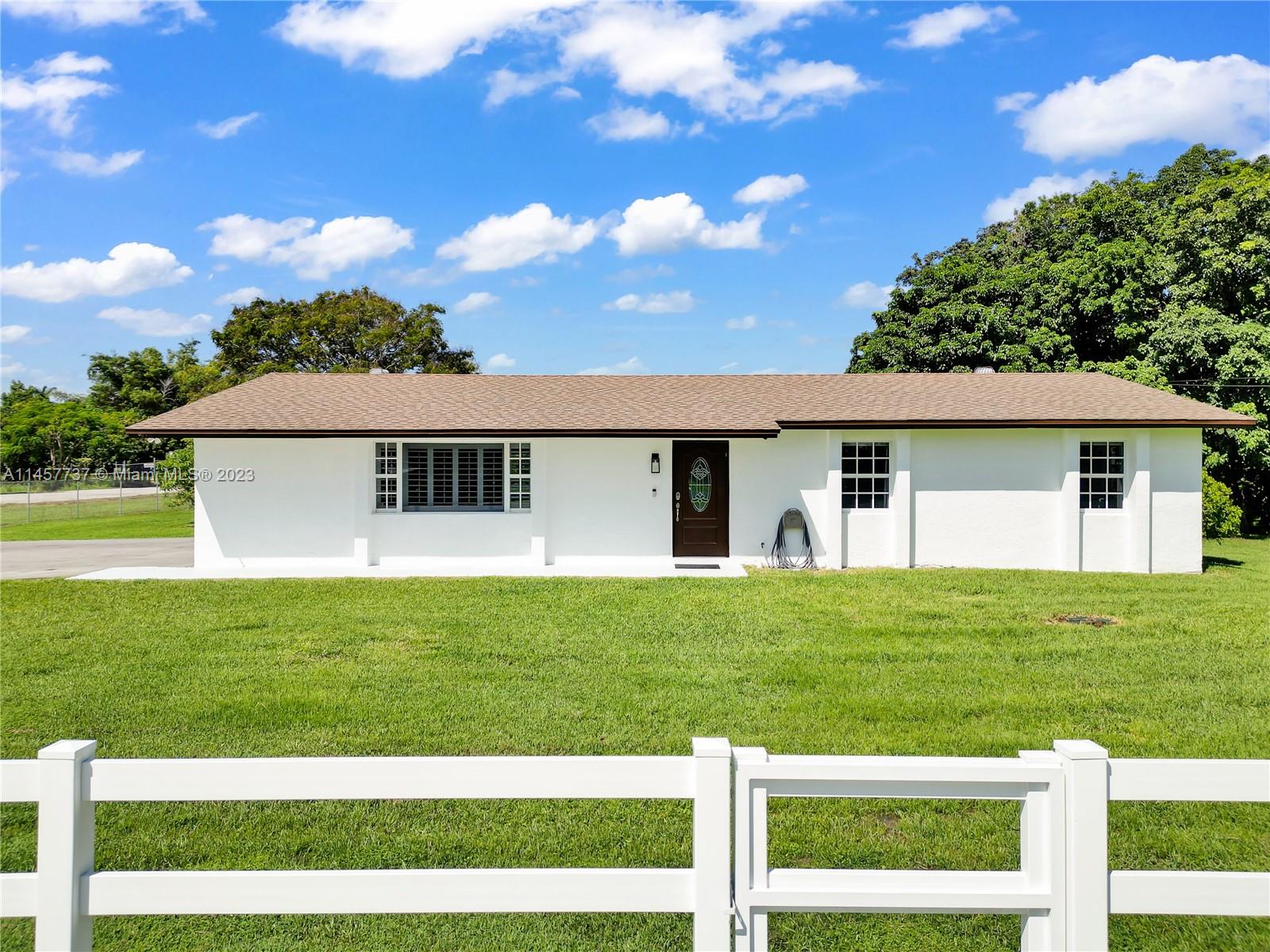 5891 Southwest 188th Avenue Southwest Ranches, FL 33332 - Photo 1 of 12 a front view of a house with a yard
