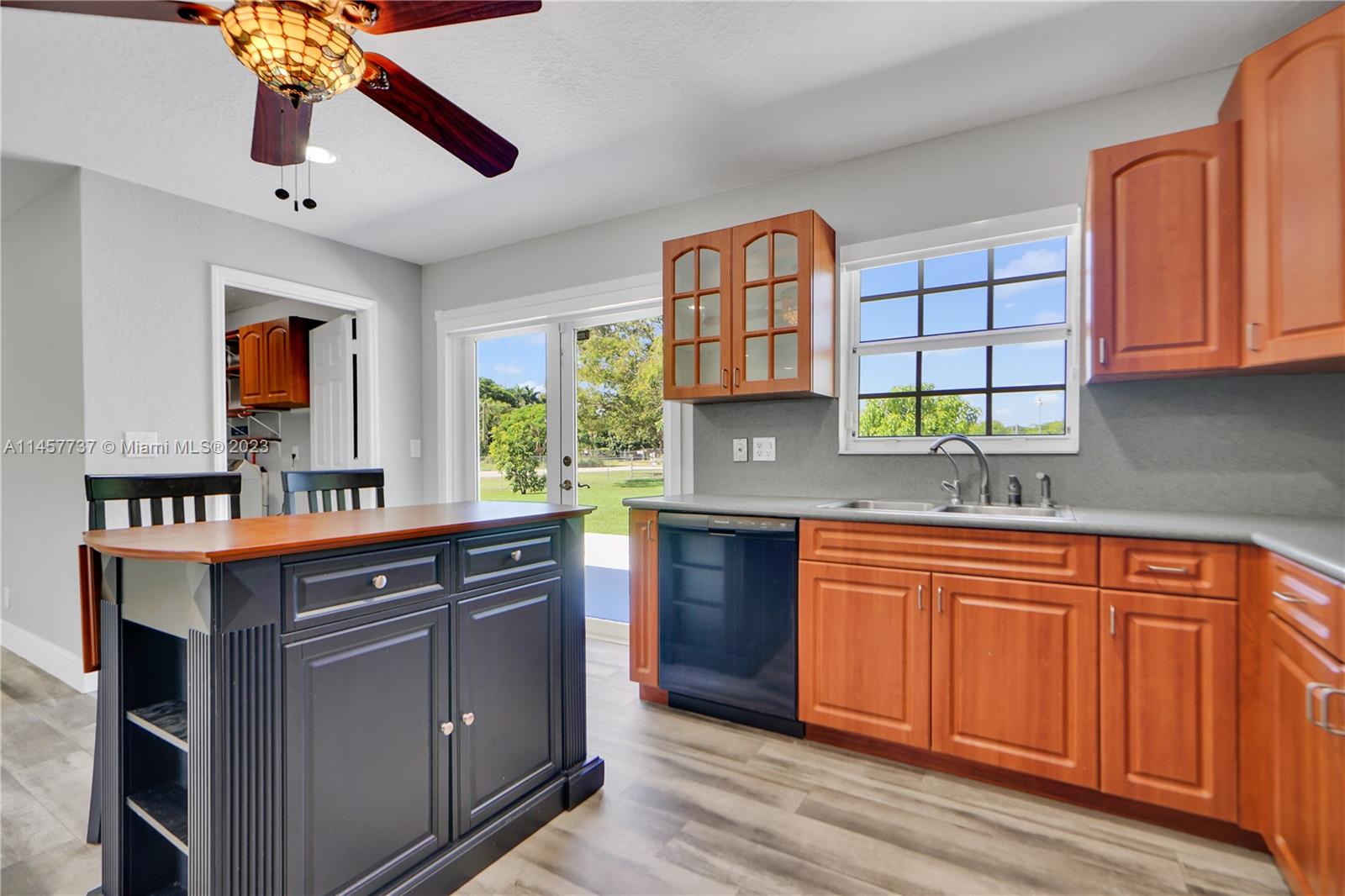 5891 Southwest 188th Avenue Southwest Ranches, FL 33332 - Photo 8 of 12 a kitchen with stainless steel appliances granite countertop a sink and cabinets