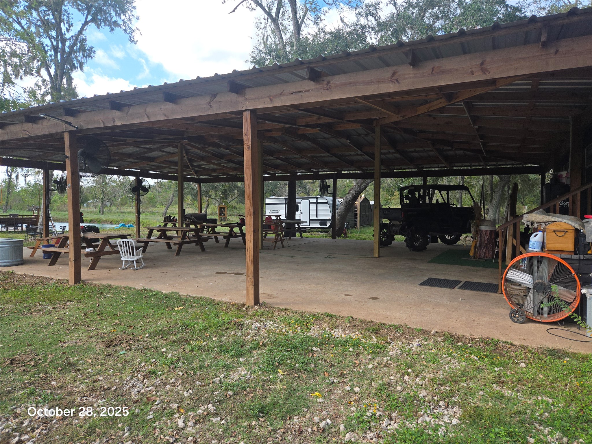 4915 West Farm To Market 1462 Rosharon, TX 77583 - Photo 3 of 17 a view of a patio with table and chairs under an umbrella