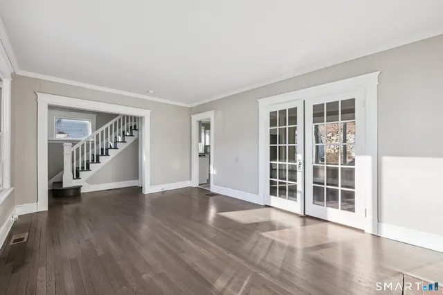 wooden floor in a room with a window