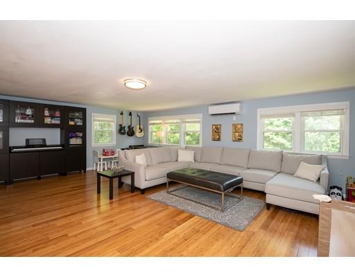 18 Austin Road Sudbury, MA 01776 - Photo 12 of 38 a living room with furniture and a flat screen tv