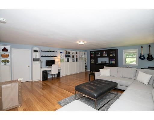 18 Austin Road Sudbury, MA 01776 - Photo 13 of 38 a living room with furniture and a table