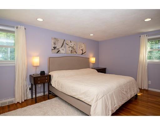 18 Austin Road Sudbury, MA 01776 - Photo 16 of 38 a bedroom with a bed and wooden floor