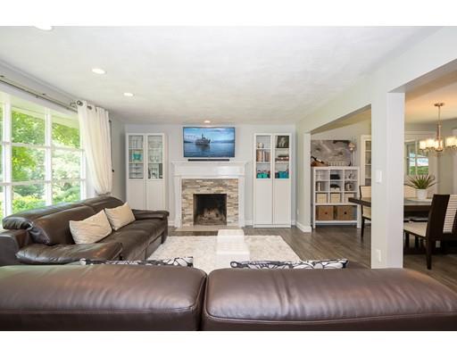 18 Austin Road Sudbury, MA 01776 - Photo 2 of 38 a living room with furniture and a fireplace