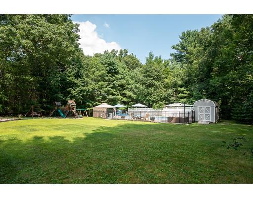 18 Austin Road Sudbury, MA 01776 - Photo 34 of 38 a backyard of a house with table and chairs