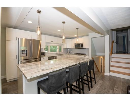 18 Austin Road Sudbury, MA 01776 - Photo 8 of 38 a kitchen with stainless steel appliances granite countertop wooden floor window and refrigerator