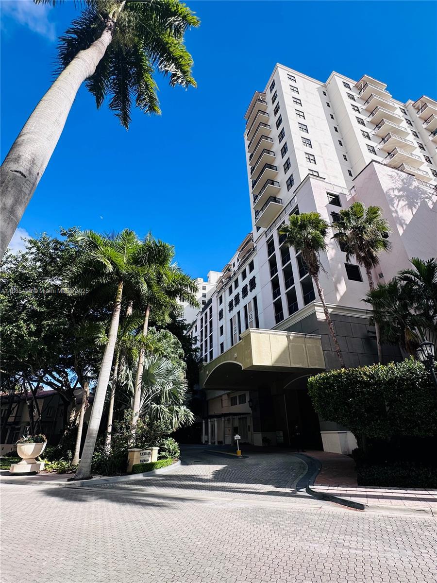 888 Douglas Road, Unit 1512 Coral Gables, FL 33134 - Photo 20 of 20 a front view of a house with garden
