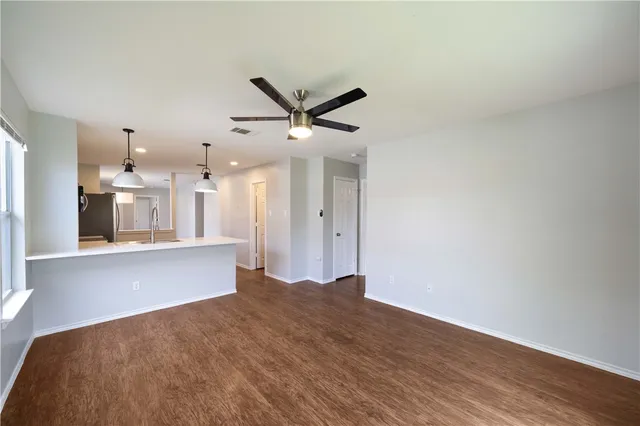 a view of a kitchen with a sink and a dishwasher