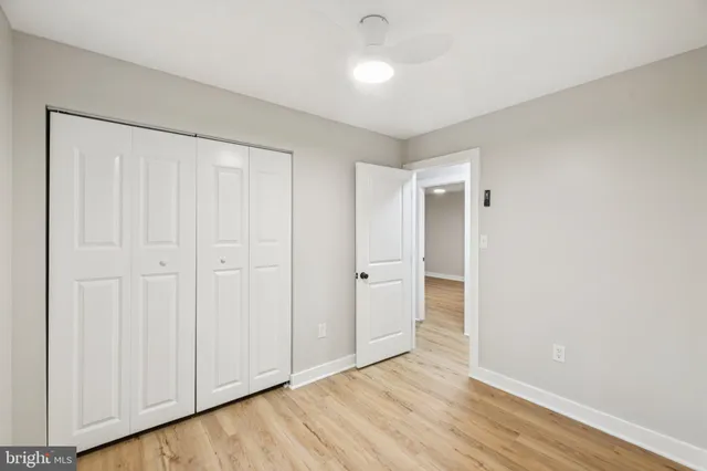 a bathroom with a bathtub shower sink vanity and toilet
