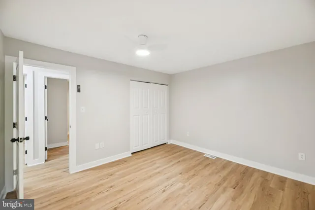 a view of wooden floor and windows in a room