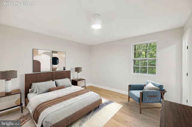 a view of an empty room and wooden floor