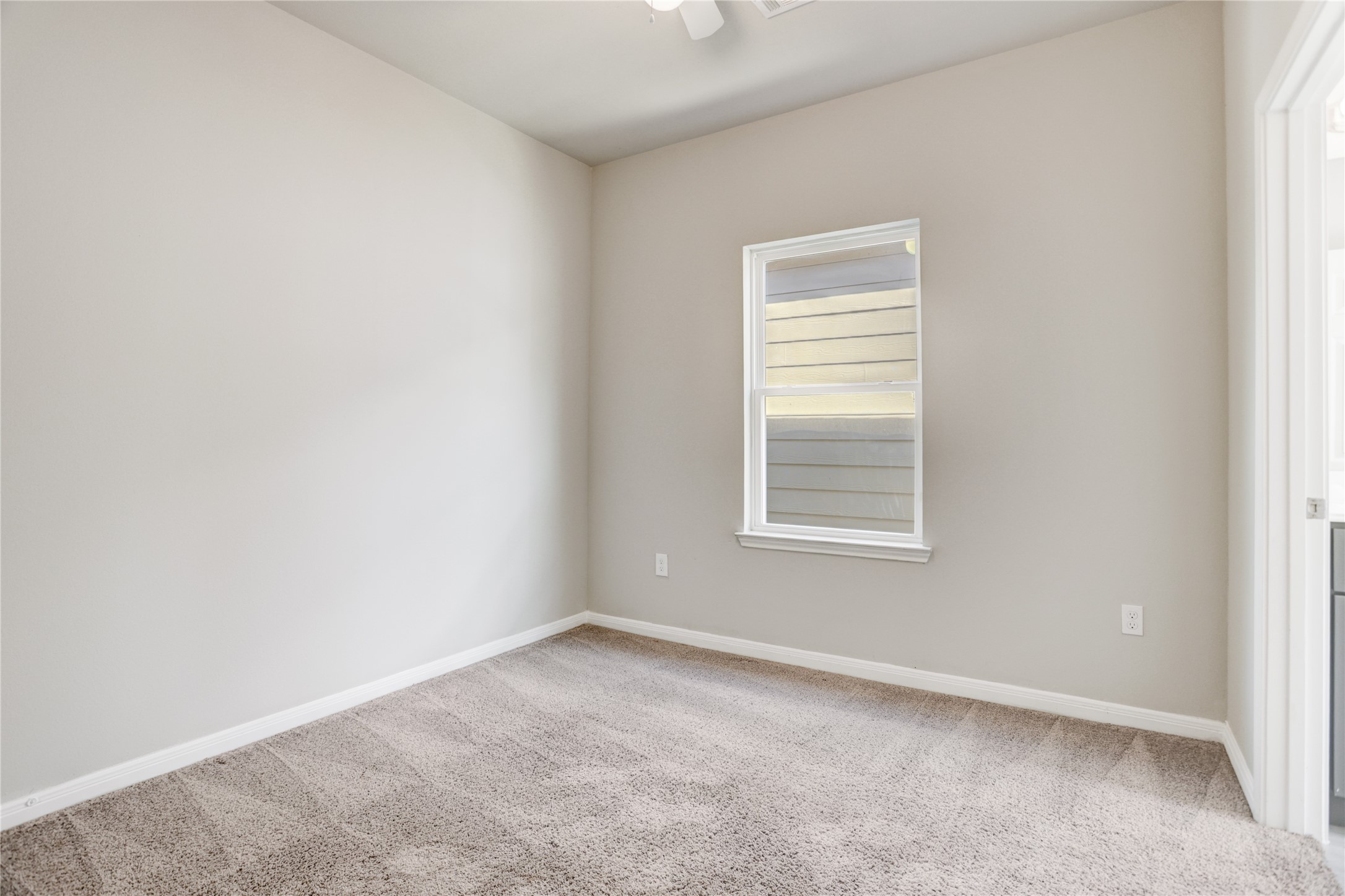 1045 Marcolin Street Houston, TX 77088 - Photo 12 of 16 an empty room with a window