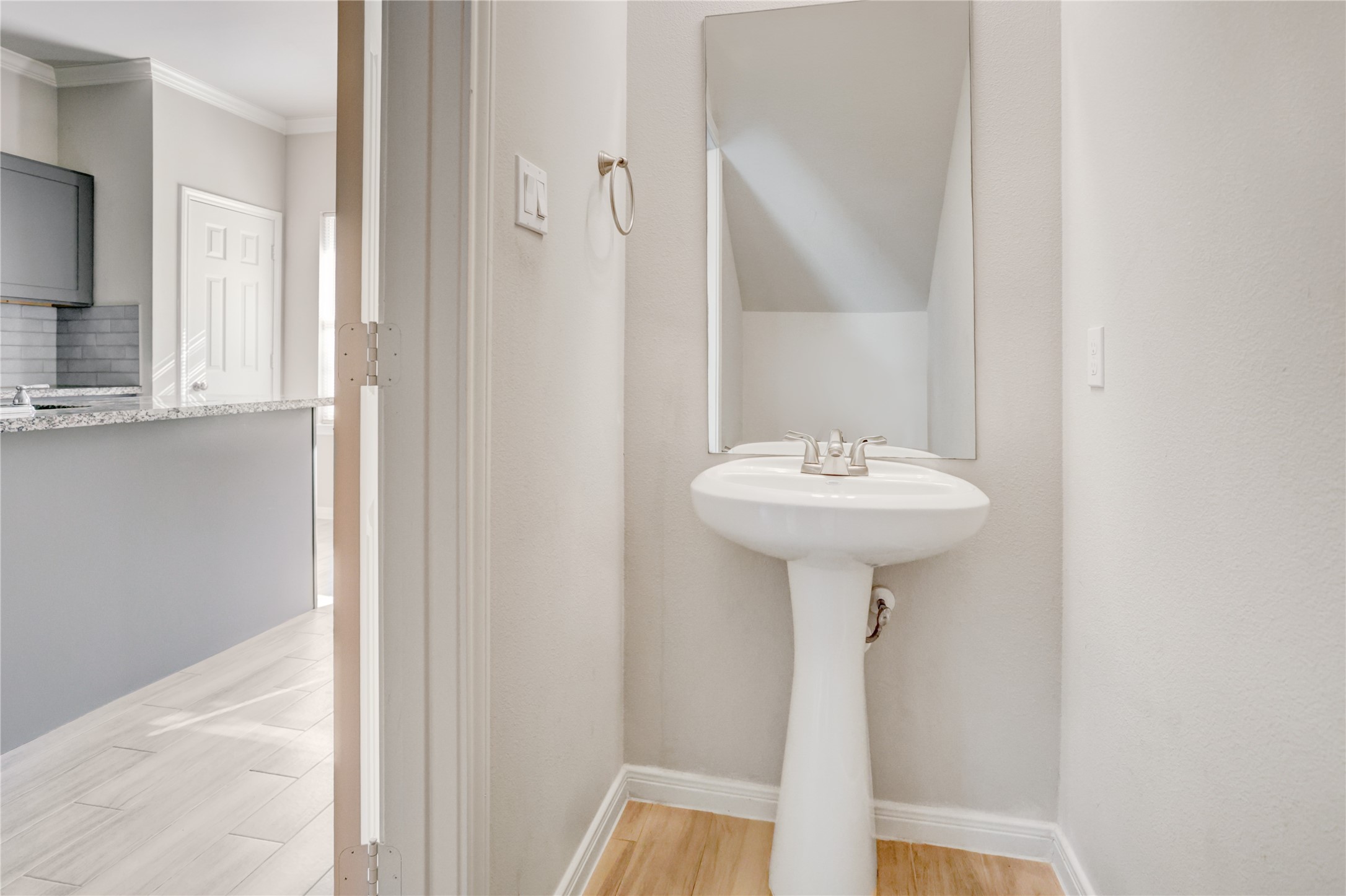 1045 Marcolin Street Houston, TX 77088 - Photo 6 of 16 a bathroom with a sink a mirror and a window
