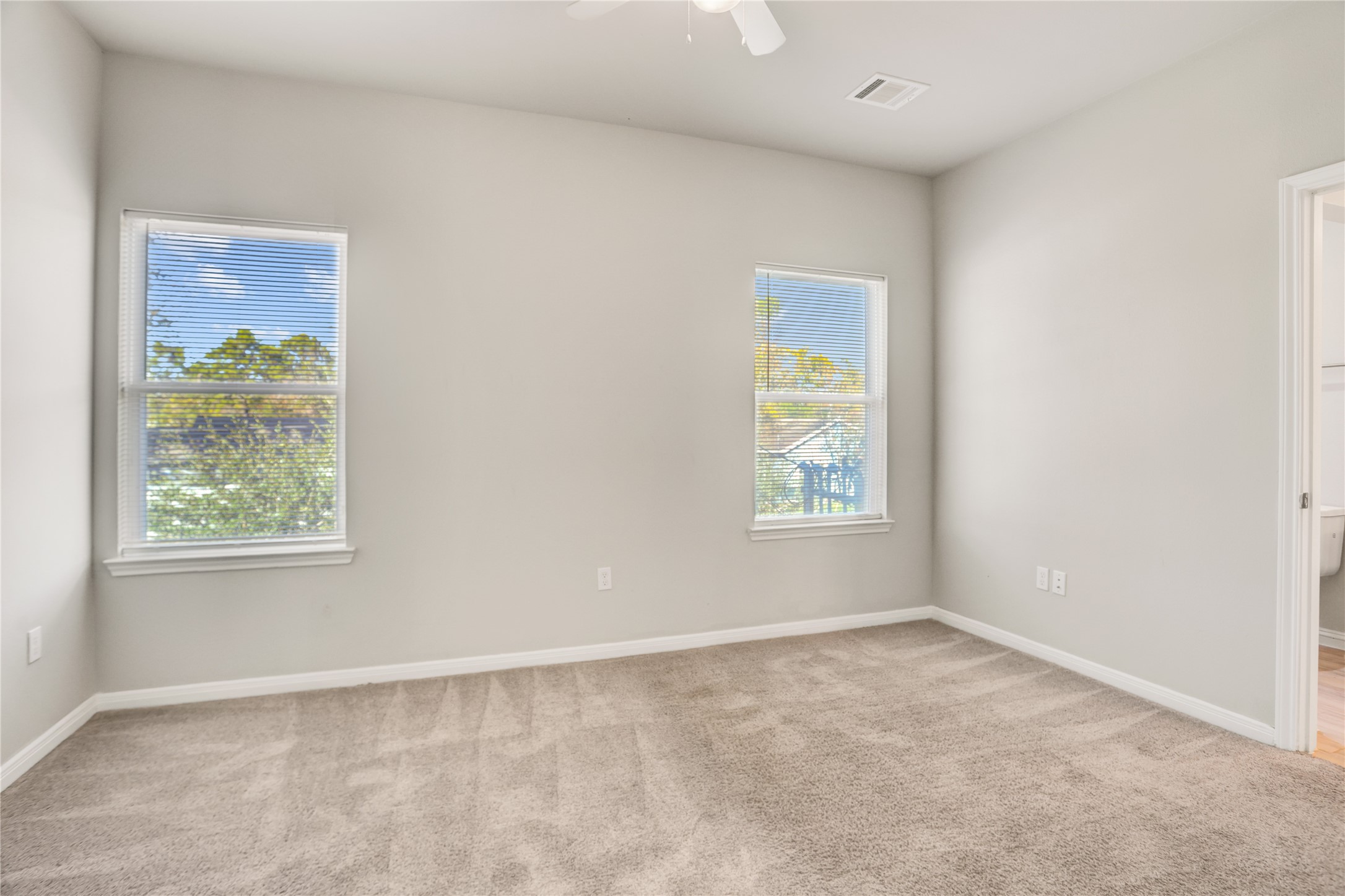 1045 Marcolin Street Houston, TX 77088 - Photo 8 of 16 an empty room with windows