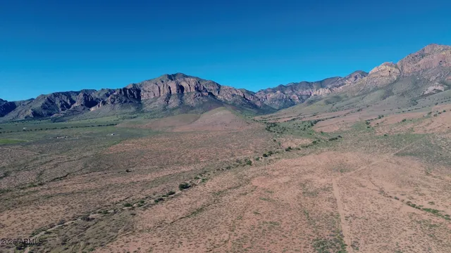 a view of a dry yard with mountain