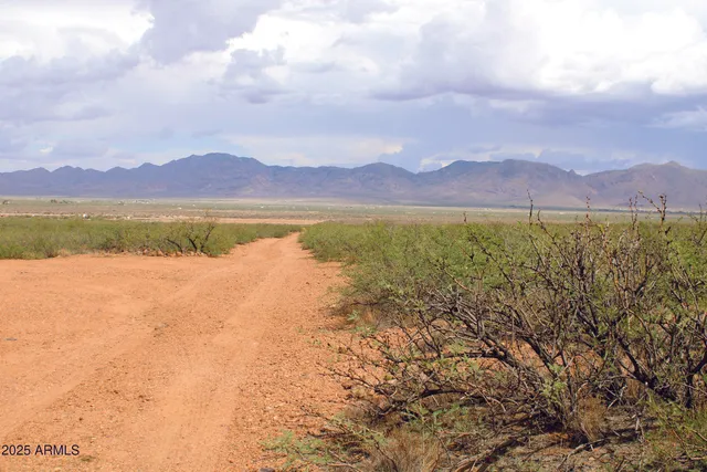 a view of an ocean and a mountain