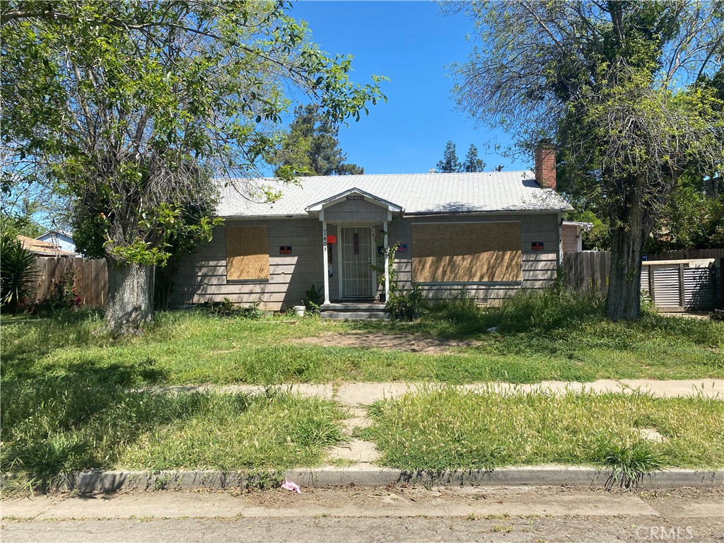 1405 East 22nd Street Merced, CA 95340 - Photo 1 of 1 a front view of a house with a yard