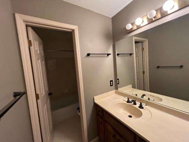 5417 Trentham Drive Atlanta, GA 30338 - Photo 17 of 18 a bathroom with a sink vanity and shower