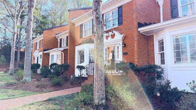 5417 Trentham Drive Atlanta, GA 30338 - Photo 2 of 18 a view of a brick building next to a yard