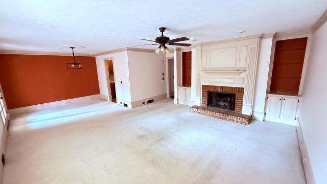 5417 Trentham Drive Atlanta, GA 30338 - Photo 5 of 18 a view of a livingroom with fireplace and a chandelier