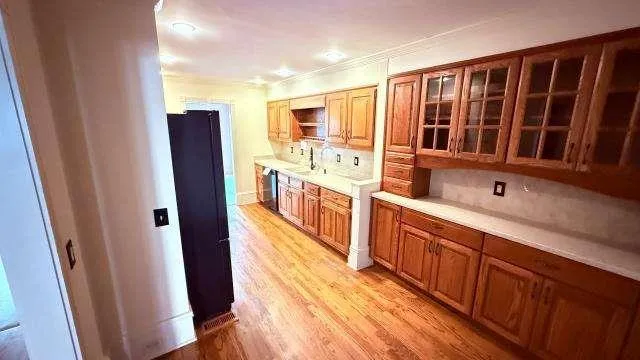 a kitchen with stainless steel appliances a refrigerator and a sink