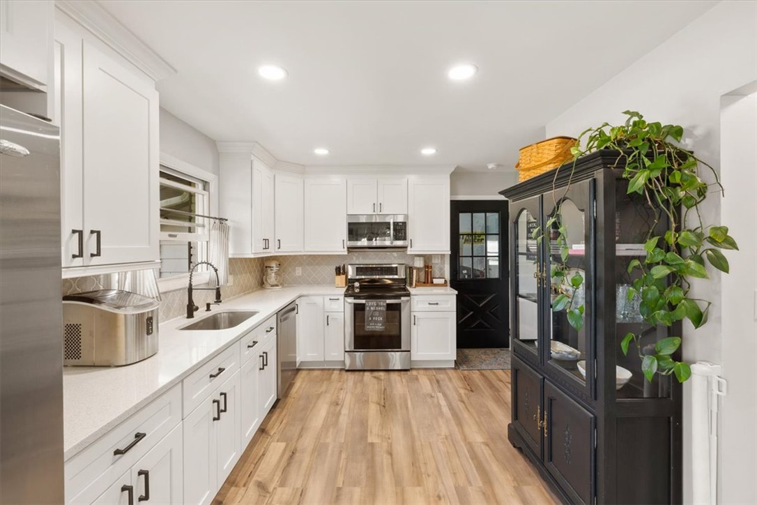 9555 Clyo Road Dayton, OH 45458 - Photo 11 of 31 This bright kitchen features modern appliances and ample storage, perfect for culinary adventures.