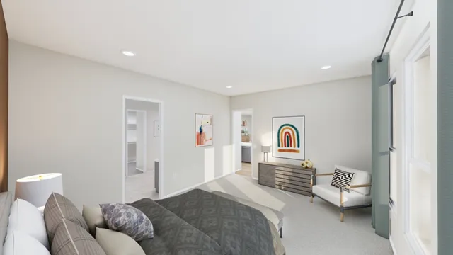 a bedroom with a bed and a couch