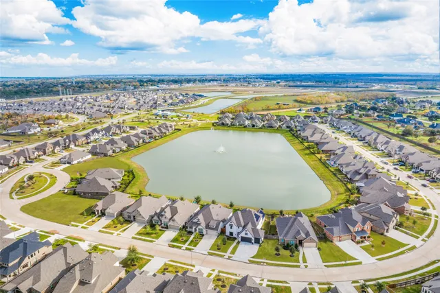 a view of a swimming pool with a lounge chair