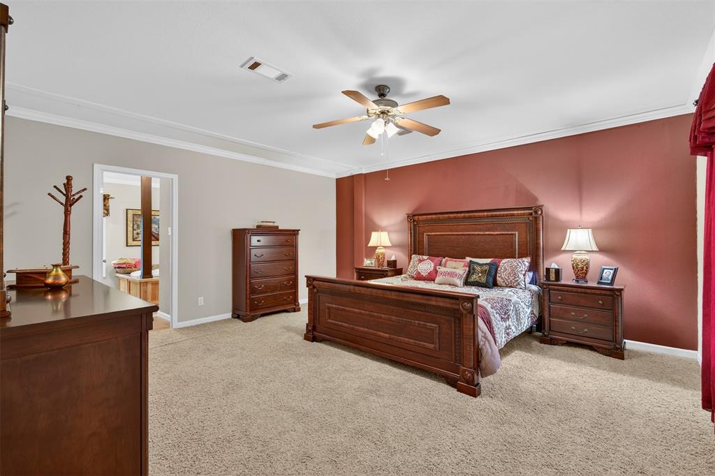8794 Castle Dale Loop Shreveport, LA 71107 - Photo 17 of 31 Bedroom with crown molding, light carpet, and a ceiling fan