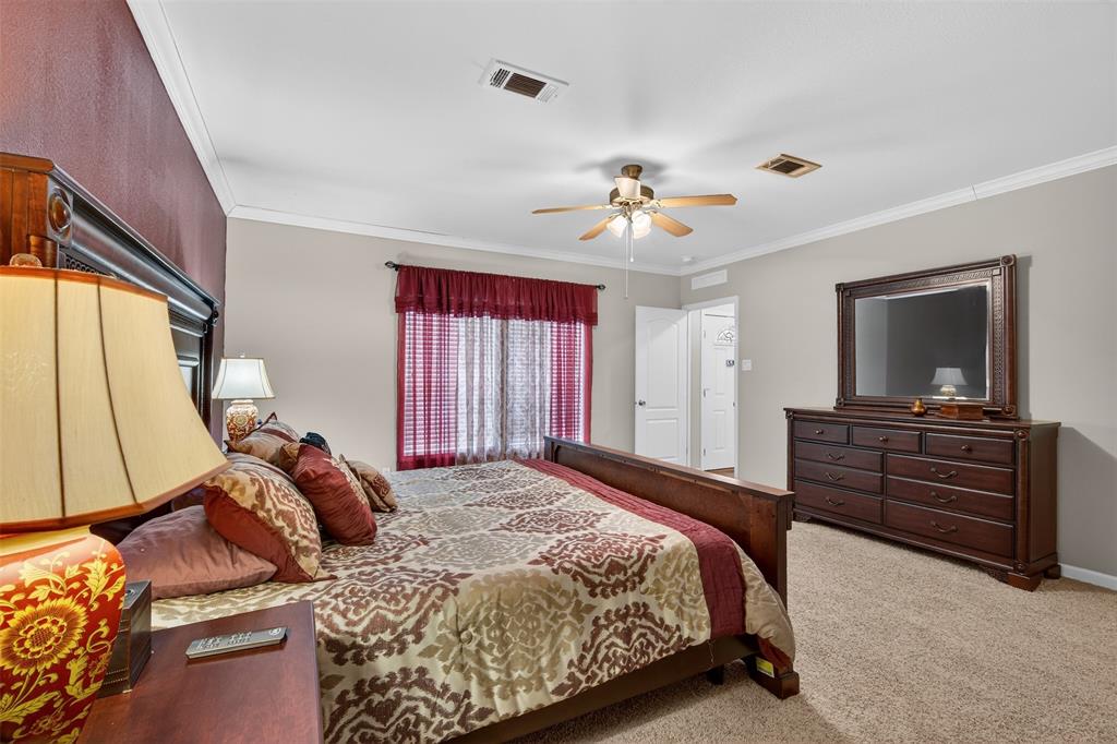 8794 Castle Dale Loop Shreveport, LA 71107 - Photo 18 of 31 Carpeted bedroom with ornamental molding and a ceiling fan