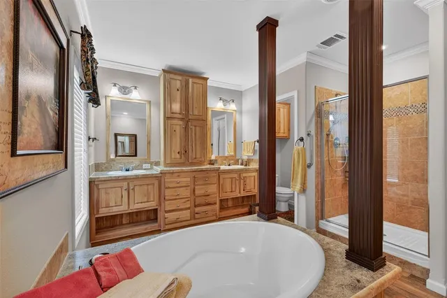a spacious bathroom with a granite countertop sink and a mirror